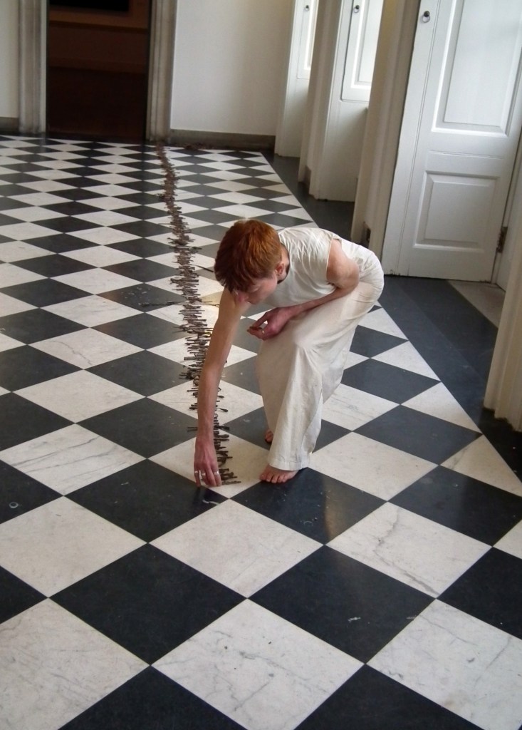 'Jetsam', Rachel Gomme, performance with metal debris, 2014